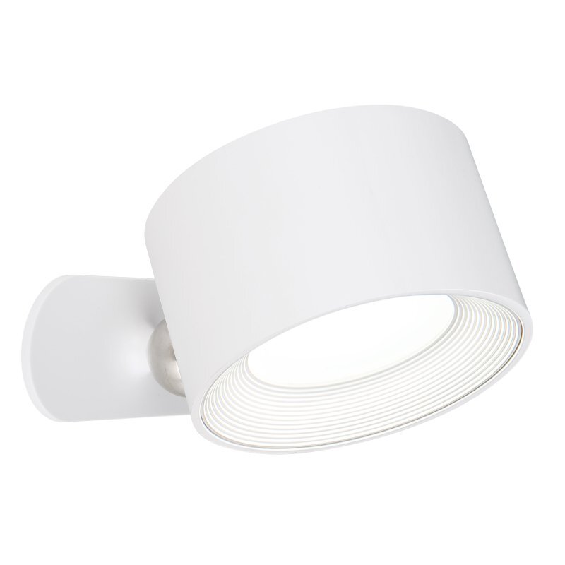 Biała lampa o cylindrycznym kształcie z widocznym źródłem światła wewnątrz. Lampa jest zamontowana na metalowym uchwycie.