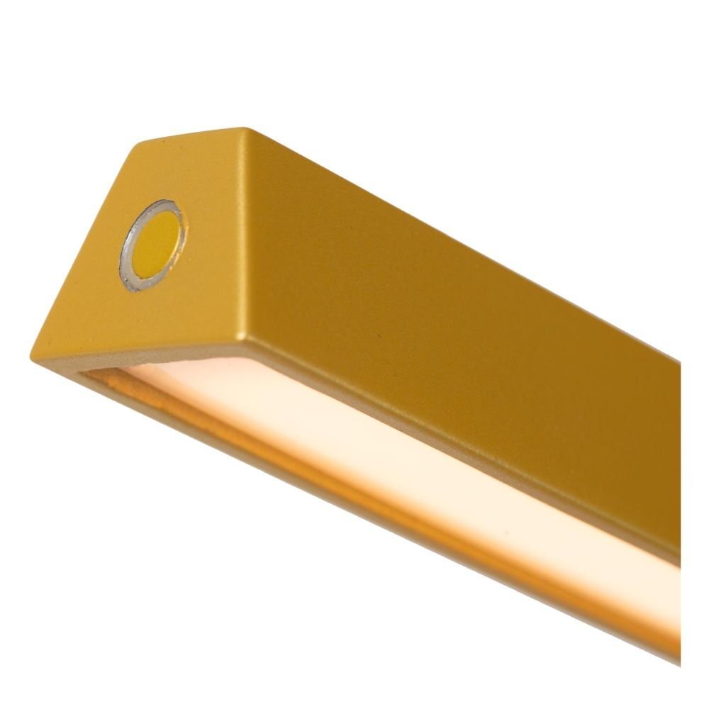 Zbliżenie na żółty, prostokątny element lampy z wbudowanym źródłem światła LED. Na końcu widoczny jest okrągły przycisk.