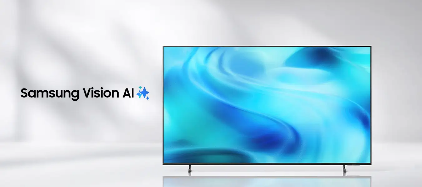 2026-crystal-uhd-kv-pc-start 1352x600 Obraz przedstawia telewizor z wyświetlaczem pokazującym abstrakcyjne, niebieskie wzory. Obok znajduje się tekst \'Samsung Vision AI\'.