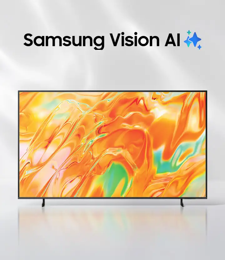 Telewizor z cienką ramką wyświetla abstrakcyjny, kolorowy wzór w odcieniach pomarańczowego i zielonego. Nad ekranem widoczny jest napis \'Samsung Vision AI\' z niebieską ikoną gwiazdki.