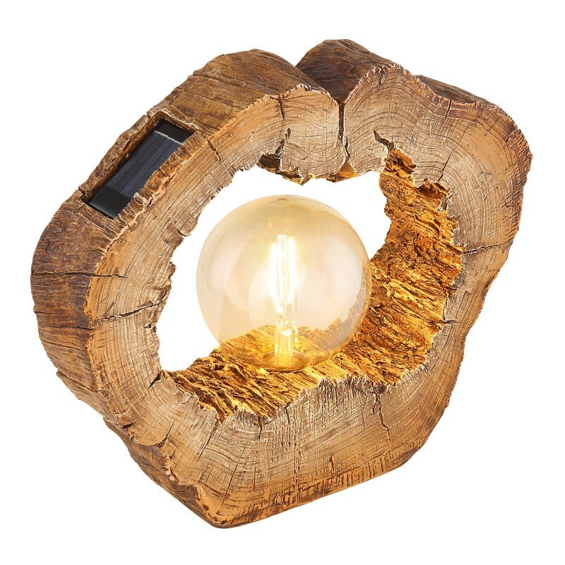 Lampa solarna LED w kształcie drewnianego pnia z widoczną żarówką w środku. Na powierzchni znajduje się panel słoneczny.