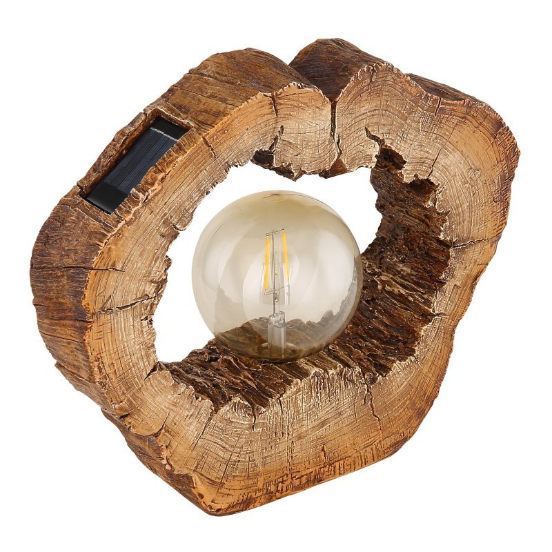 Lampa solarna LED w kształcie drewnianego pnia z przezroczystą żarówką w środku. Na powierzchni widoczny jest panel słoneczny.