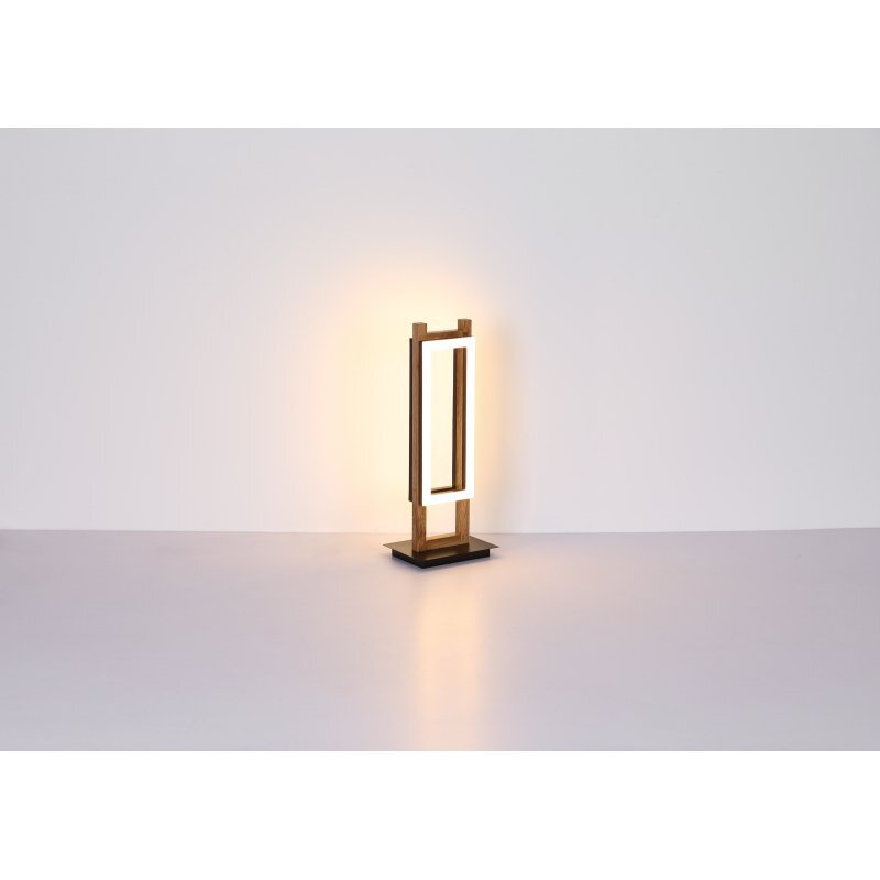 Lampa stołowa LED o nowoczesnym designie, wykonana z czarnego matowego drewna MDF, emituje ciepłe światło. Lampa ma prostokątną formę i stoi na płaskiej podstawie.