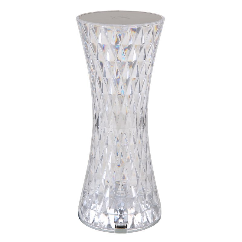 Lampa stołowa o kształcie klepsydry, wykonana z przezroczystego materiału o kryształowej strukturze. Na górze widoczny jest port USB.