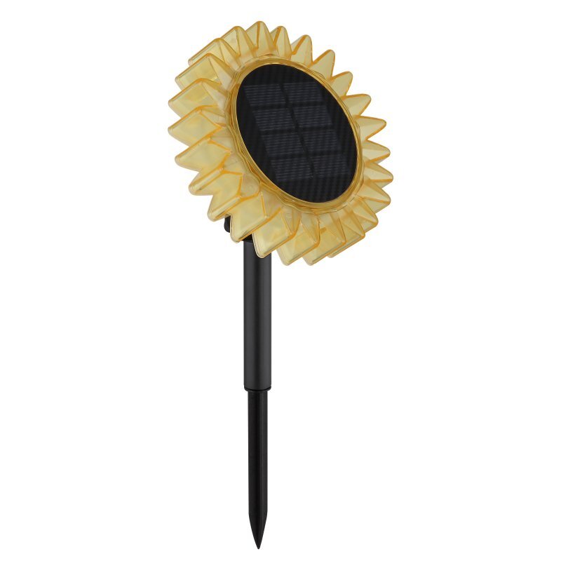 Lampa solarna w kształcie słonecznika z żółtymi płatkami i czarnym panelem solarnym na szczycie. Posiada czarny, smukły trzonek do wbicia w ziemię.