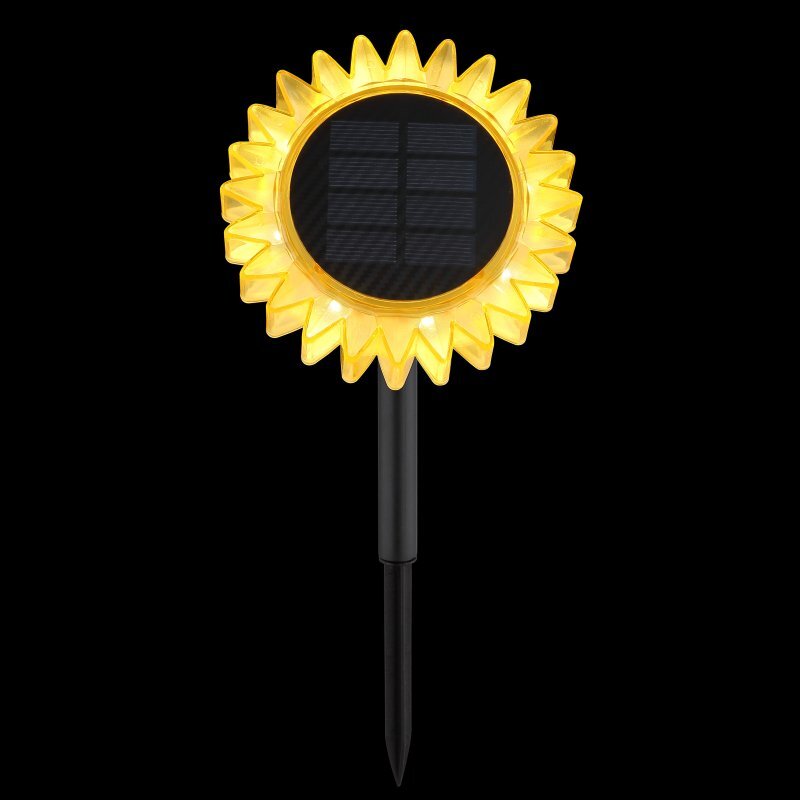 Lampa solarna w kształcie słonecznika z żółtymi płatkami i czarnym panelem solarnym pośrodku, zamontowana na czarnym pręcie.