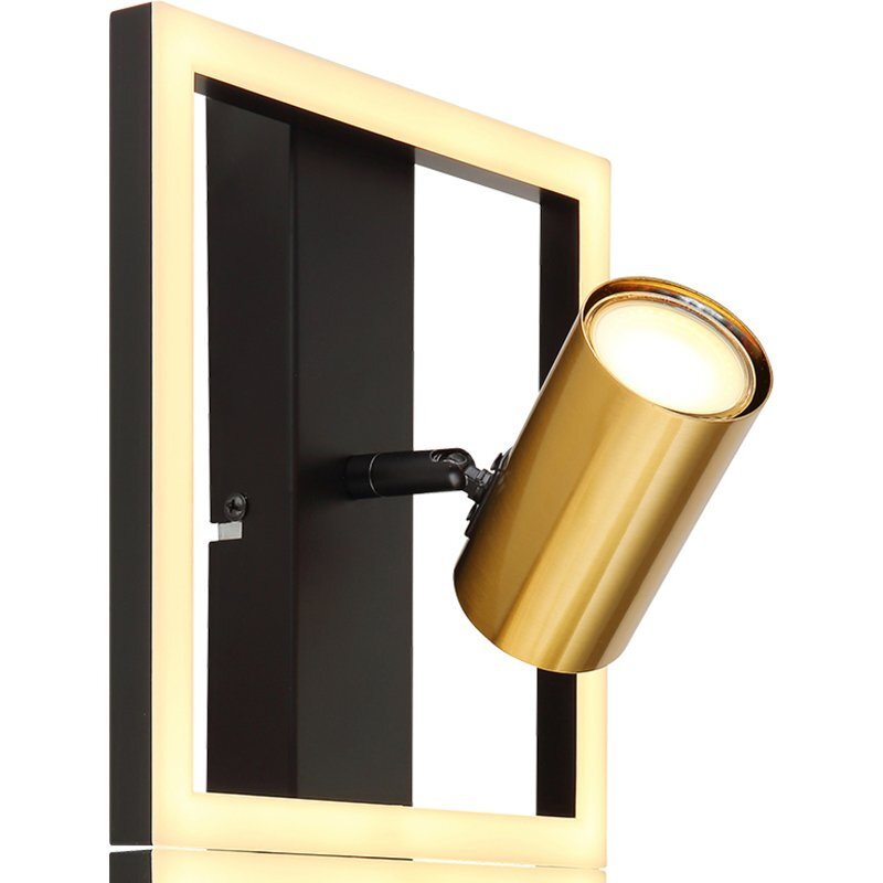 Lampa sufitowa LED z czarno-złotym reflektorem zamontowana na prostokątnej ramie z podświetleniem. Reflektor jest cylindryczny i skierowany w bok.