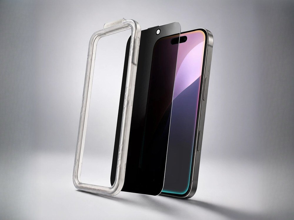 Szkło prywatyzujące AmazingThing Privacy z ramką montażową obok iPhone'a na szarym tle, ujęcie trójćwierciowe.