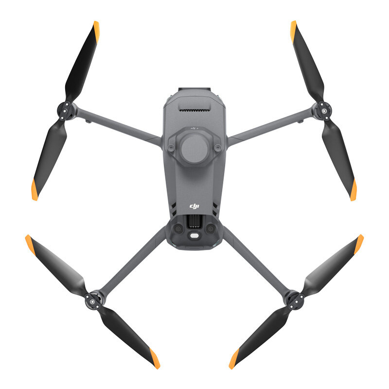 Na obrazie widoczny jest dron z czterema śmigłami, w kolorze szarym z pomarańczowymi końcówkami. Na korpusie drona znajduje się logo \'DJI\'.