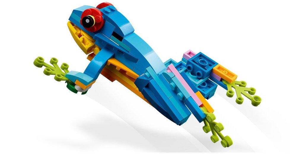 Zestaw klocków przedstawiający kolorową papugę zbudowaną z elementów LEGO. Papuga ma niebieskie, żółte i zielone elementy oraz czerwone oczy.