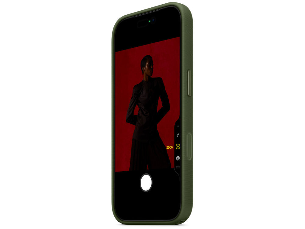 Zielone etui na telefon z widocznym ekranem, na którym znajduje się zdjęcie osoby na czerwonym tle. Etui ma wycięcia na przyciski boczne.