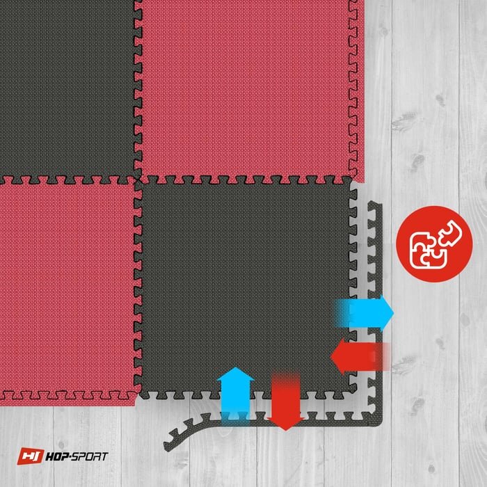 Obraz przedstawia matę puzzle EVA w kolorach czarnym i czerwonym, ułożoną na drewnianej podłodze. W prawym dolnym rogu znajduje się logo \'HOP-SPORT\' oraz ikona z puzzlami na czerwonym tle.