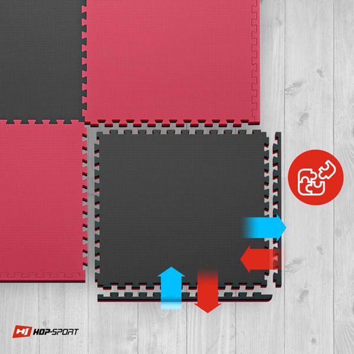 Obraz przedstawia czarno-czerwone maty puzzle EVA ułożone na drewnianej podłodze. W prawym dolnym rogu znajduje się logo \'HOP-SPORT\' oraz ikona z puzzlami na czerwonym tle.