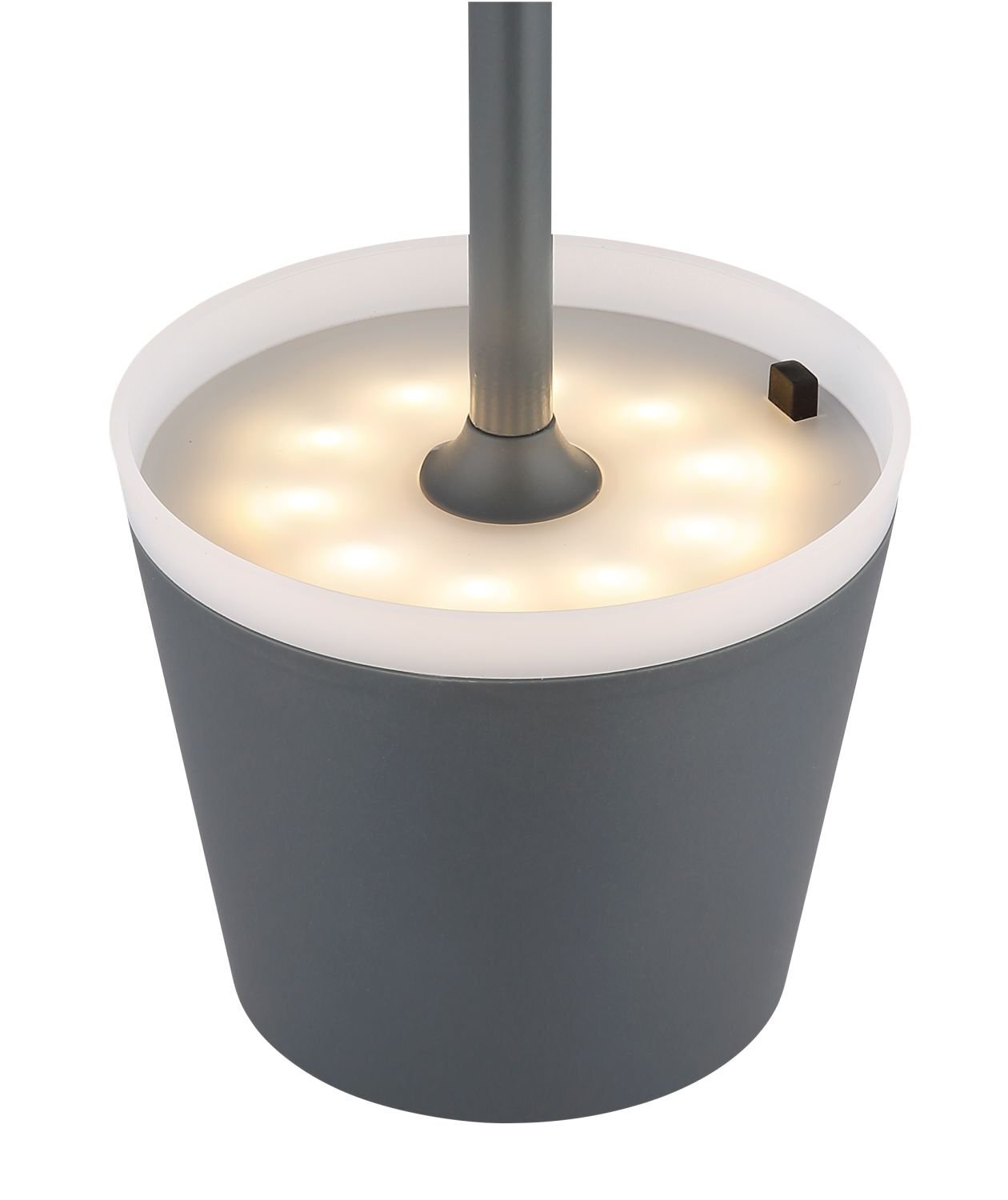 Obraz przedstawia zewnętrzną lampę stołową LED z szarym, cylindrycznym kloszem i białym, świecącym obrzeżem. Lampa posiada centralnie umieszczony pręt i jest przeznaczona do użytku w ogrodzie lub na tarasie.