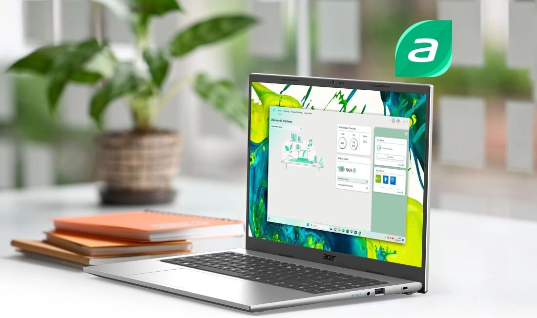 Laptop Acer Aspire Go z aplikacją AcerSense wyświetla panel zarządzania systemem podczas pracy biurowej przy biurku 