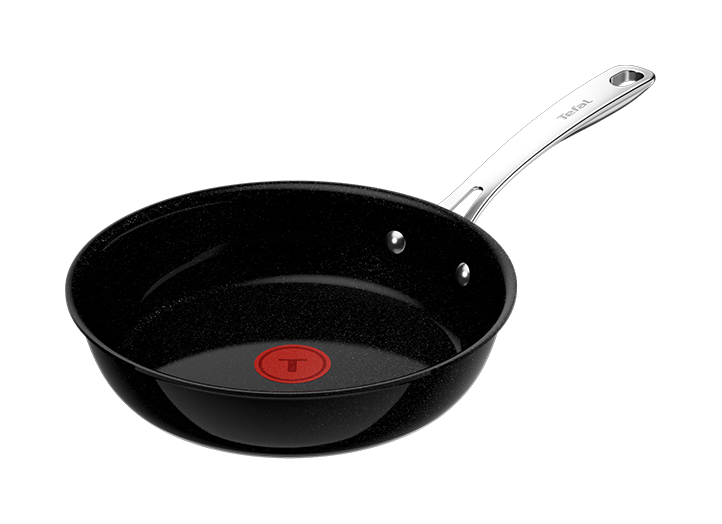 Czarna patelnia z czerwonym okrągłym wskaźnikiem na dnie i srebrnym uchwytem z napisem \'Tefal\'.