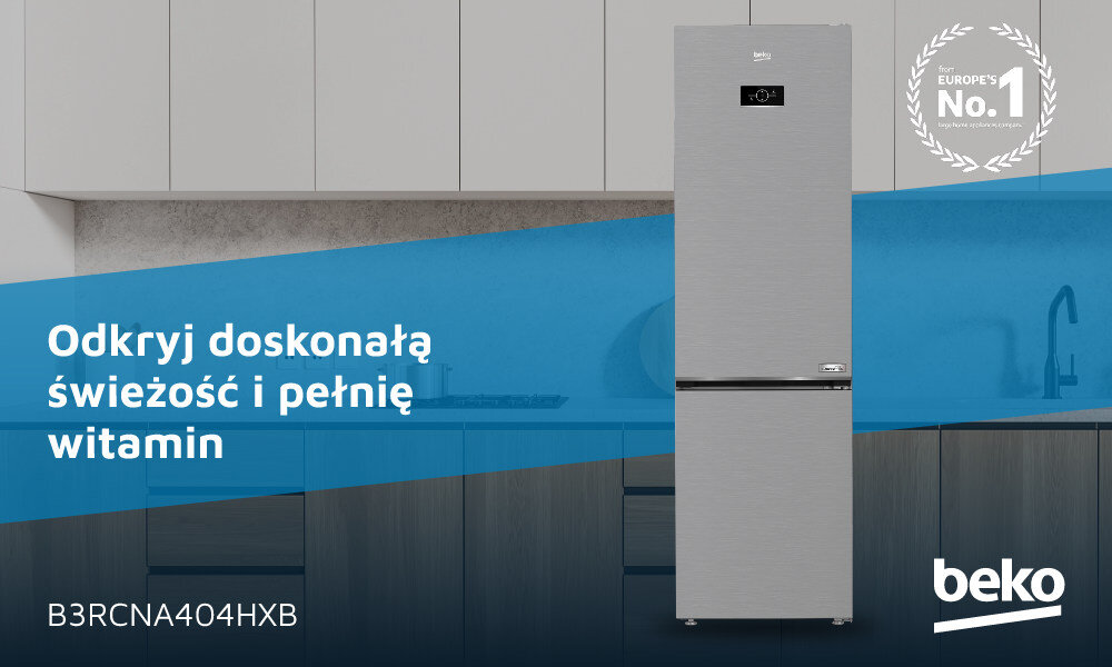 Na obrazie znajduje się lodówka w kolorze inox, umieszczona na tle kuchni z szafkami. Widoczny jest tekst: \'Odkryj doskonałą świeżość i pełnię witamin\', \'B3RCNA404HXB\', oraz logo \'beko\'.