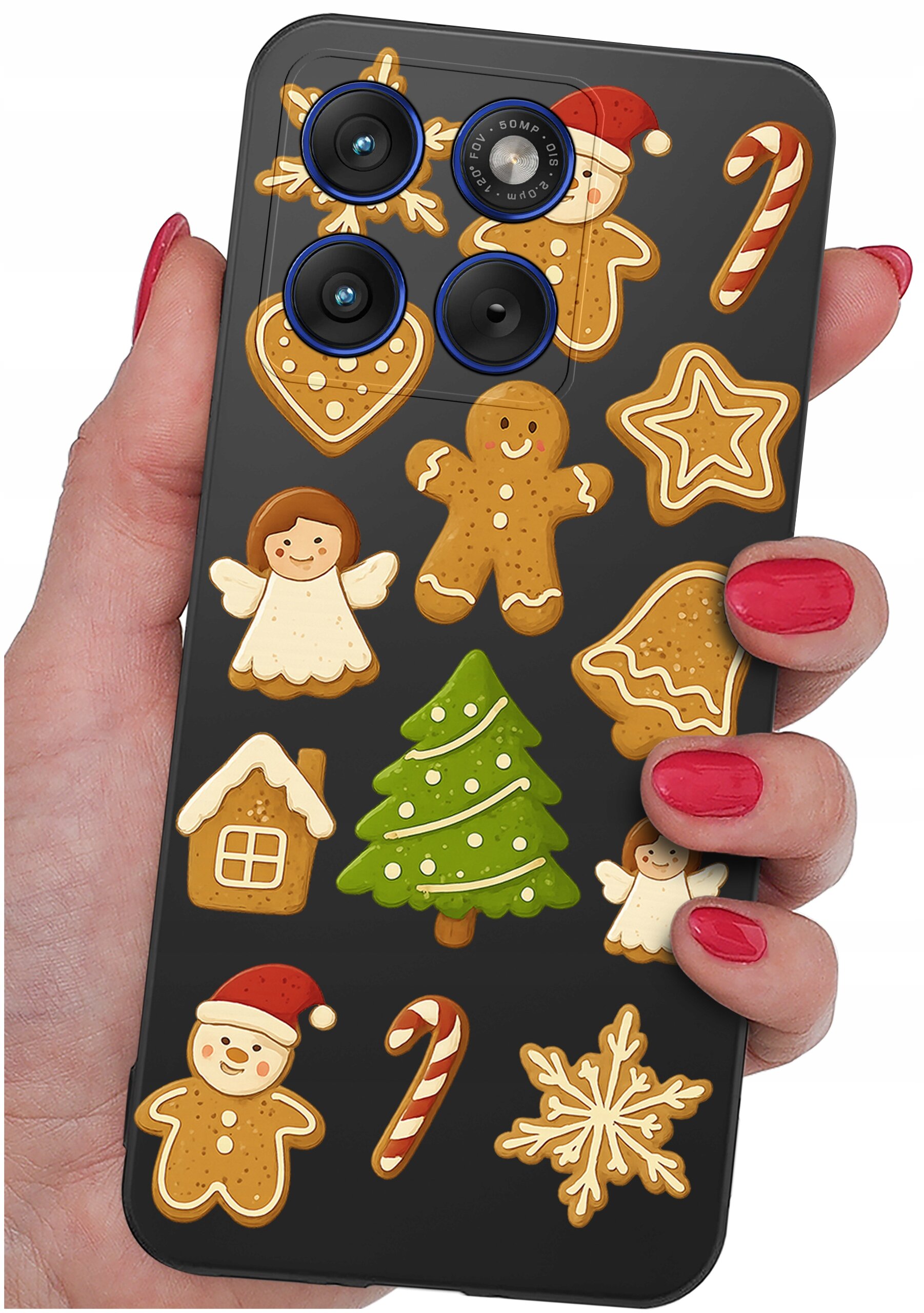 Etui na telefon z motywem świątecznych pierników, w tym choinki, aniołków i laski cukrowej. Etui jest trzymane w dłoni z pomalowanymi na czerwono paznokciami.