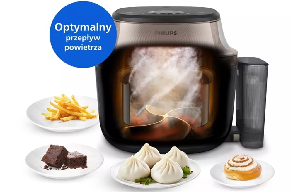 Na obrazie widoczna jest frytkownica beztłuszczowa z logo PHILIPS, z wizualizacją przepływu powietrza wewnątrz urządzenia. Obok znajdują się talerze z frytkami, ciastem, pierożkami i bułką cynamonową, a w lewym górnym rogu widnieje napis \'Optymalny przepływ powietrza\'.