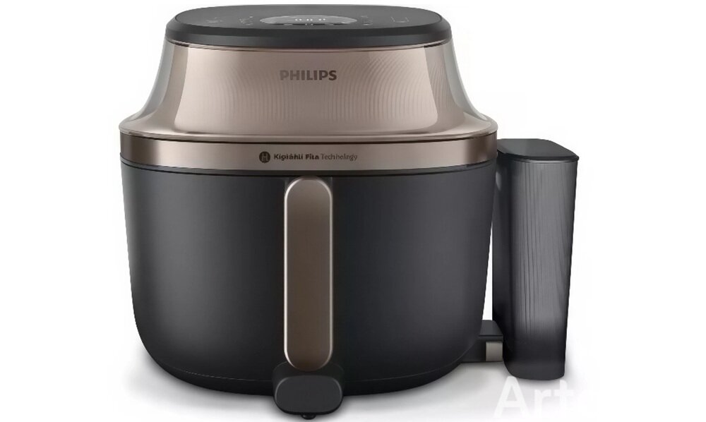 Na obrazie widoczna jest frytkownica beztłuszczowa marki PHILIPS z napisem \'Rapid Air Technology\' na obudowie. Urządzenie ma nowoczesny design w kolorze czarnym z metalicznymi akcentami.