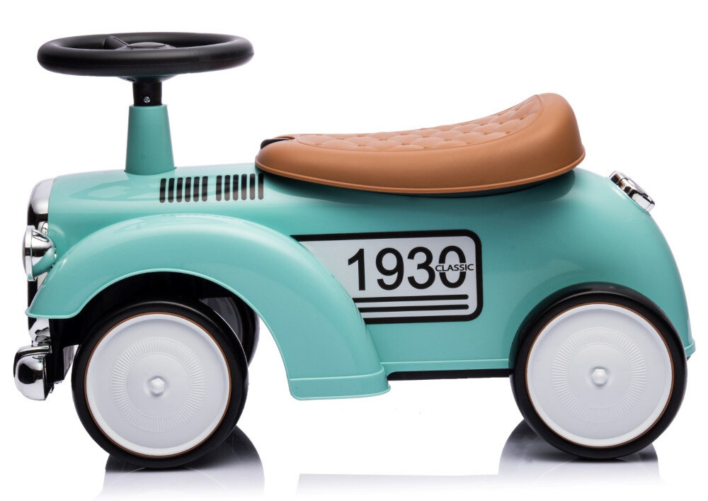 Jeździk w stylu retro w kolorze miętowym z brązowym siedzeniem i białymi kołami. Na boku widoczny jest napis \'1930 CLASSIC\'.