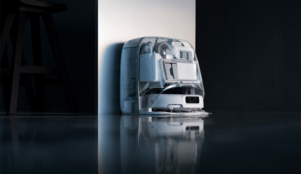 Na obrazie znajduje się robot sprzątający o nowoczesnym designie, ustawiony przy ścianie na błyszczącej podłodze. W tle widoczny jest fragment ciemnego mebla.