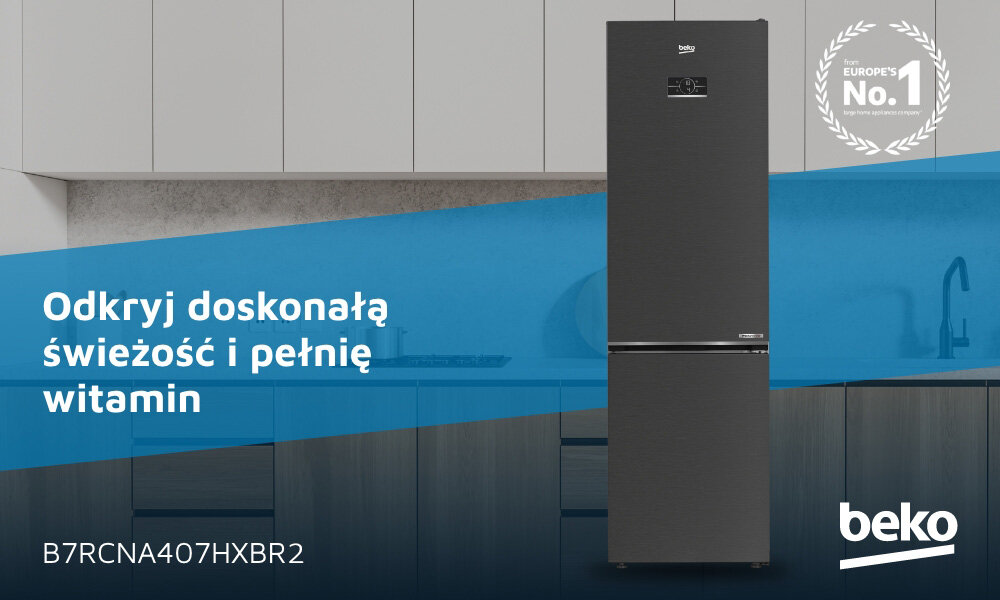 Na obrazie widoczna jest ciemnoszara lodówka z logo beko, stojąca w nowoczesnej kuchni. Na niebieskim tle znajduje się tekst: \'Odkryj doskonałą świeżość i pełnię witamin\' oraz \'B7RCNA407HXBR2\'.