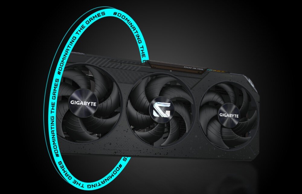 Karta graficzna GIGABYTE Radeon RX 9070 GRE Gaming OC Przednia część karty graficznej z trzema wentylatorami, otoczona świecącym okręgiem z powtarzającym się napisem '#DOMINATING THE GAMES'