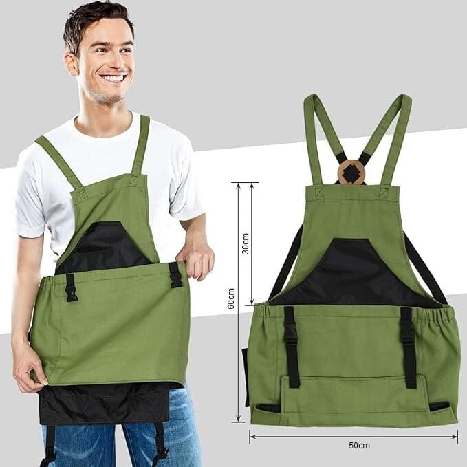 Na obrazie widoczny jest zielony fartuch ogrodowy z czarnymi elementami, noszony przez osobę. Obok fartucha znajdują się wymiary: 60 cm wysokości i 50 cm szerokości.