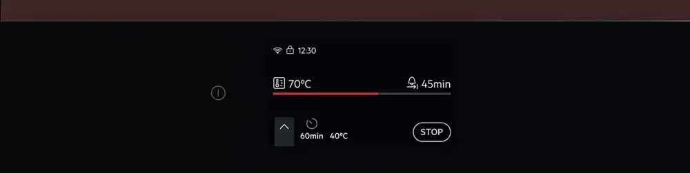 Wyświetlacz elektroniczny pokazuje temperaturę 70°C i czas 45 minut. Widoczne są także ikony Wi-Fi, blokady oraz przycisk \'STOP\'.