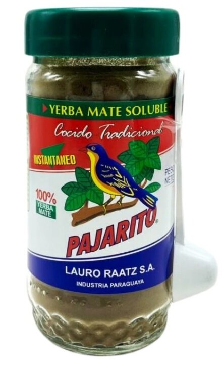 Słoik z etykietą przedstawiającą kolorowego ptaka na gałęzi, z napisami: \'Yerba Mate Soluble\', \'Cocido Tradicional\', \'Instantaneo\', \'100% Yerba Mate\', \'Pajarito\', \'Lauro Raatz S.A.\', \'Industria Paraguaya\'.