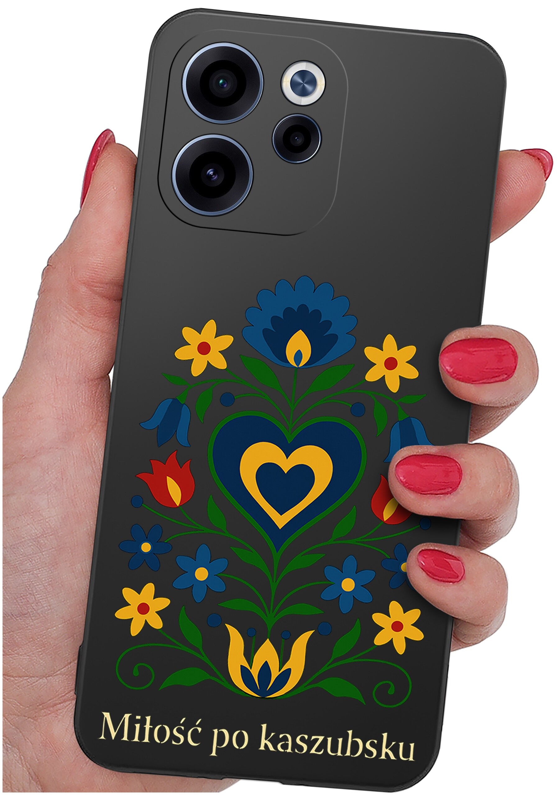 Osoba trzyma telefon z etui ozdobionym kolorowym wzorem kwiatowym i napisem \'Miłość po kaszubsku\'.