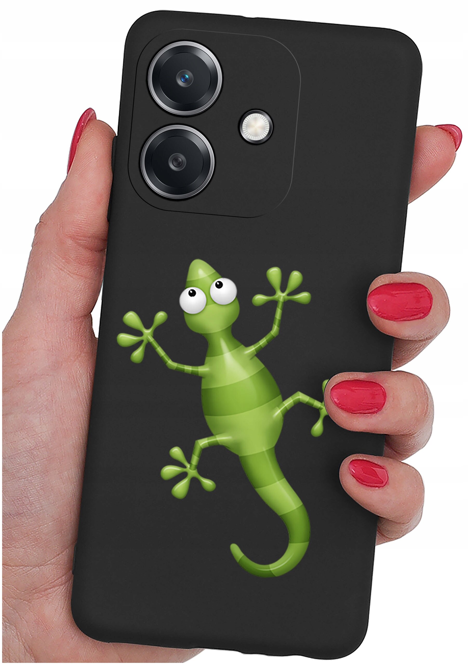 Czarna obudowa telefonu z zielonym rysunkiem jaszczurki, trzymana w dłoni z czerwonymi paznokciami. Widoczne są dwa obiektywy aparatu i lampa błyskowa.