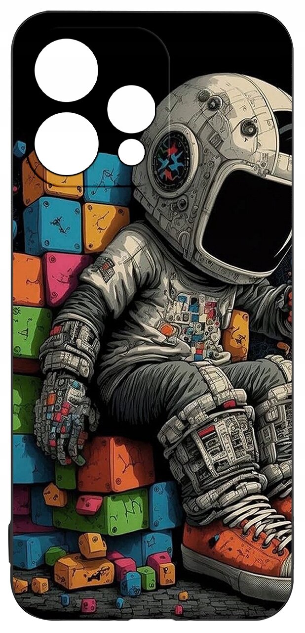 Etui przedstawia astronautę siedzącego na kolorowych, sześciennych klockach. Astronauta ma na sobie szczegółowy skafander i pomarańczowe buty.