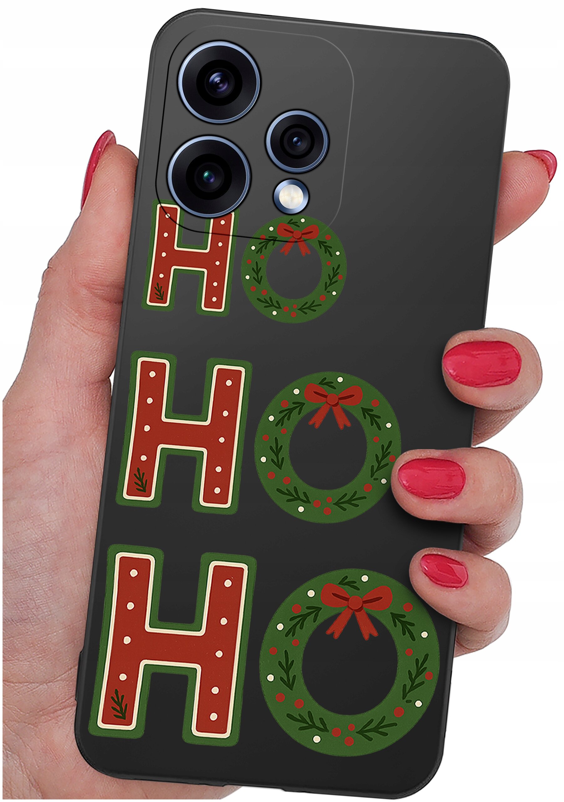 Etui na telefon z napisem \'HO HO HO\', gdzie litery \'O\' są zastąpione świątecznymi wieńcami. Etui trzymane jest w dłoni z pomalowanymi na czerwono paznokciami.