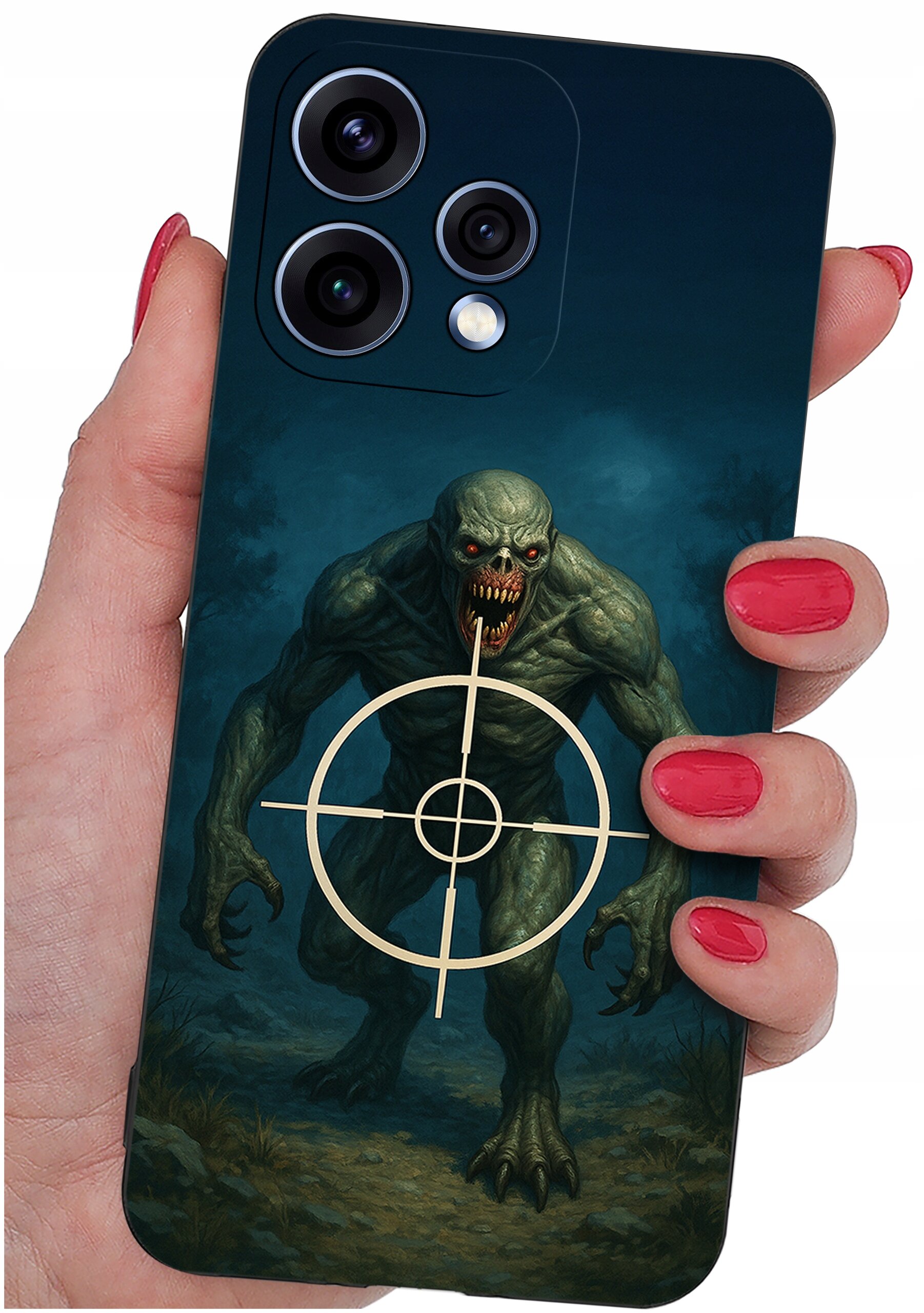Etui na telefon z grafiką przedstawiającą potwora z czerwonymi oczami i otwartymi ustami, na tle którego znajduje się celownik. Etui trzymane jest w dłoni z pomalowanymi na czerwono paznokciami.