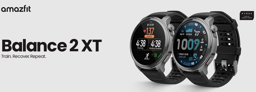Obraz przedstawia dwa smartwatche z okrągłymi tarczami, wyświetlające różne dane, takie jak tętno i czas. Po lewej stronie widnieje napis \'amazfit Balance 2 XT Train. Recover. Repeat.\'.