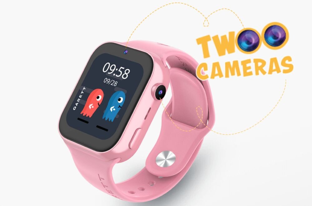 Różowy smartwatch z wyświetlaczem pokazującym godzinę 09:58 i datę 09/28, z grafiką dwóch kolorowych postaci. Obok zegarka widoczny jest napis \'TWO CAMERAS\'.