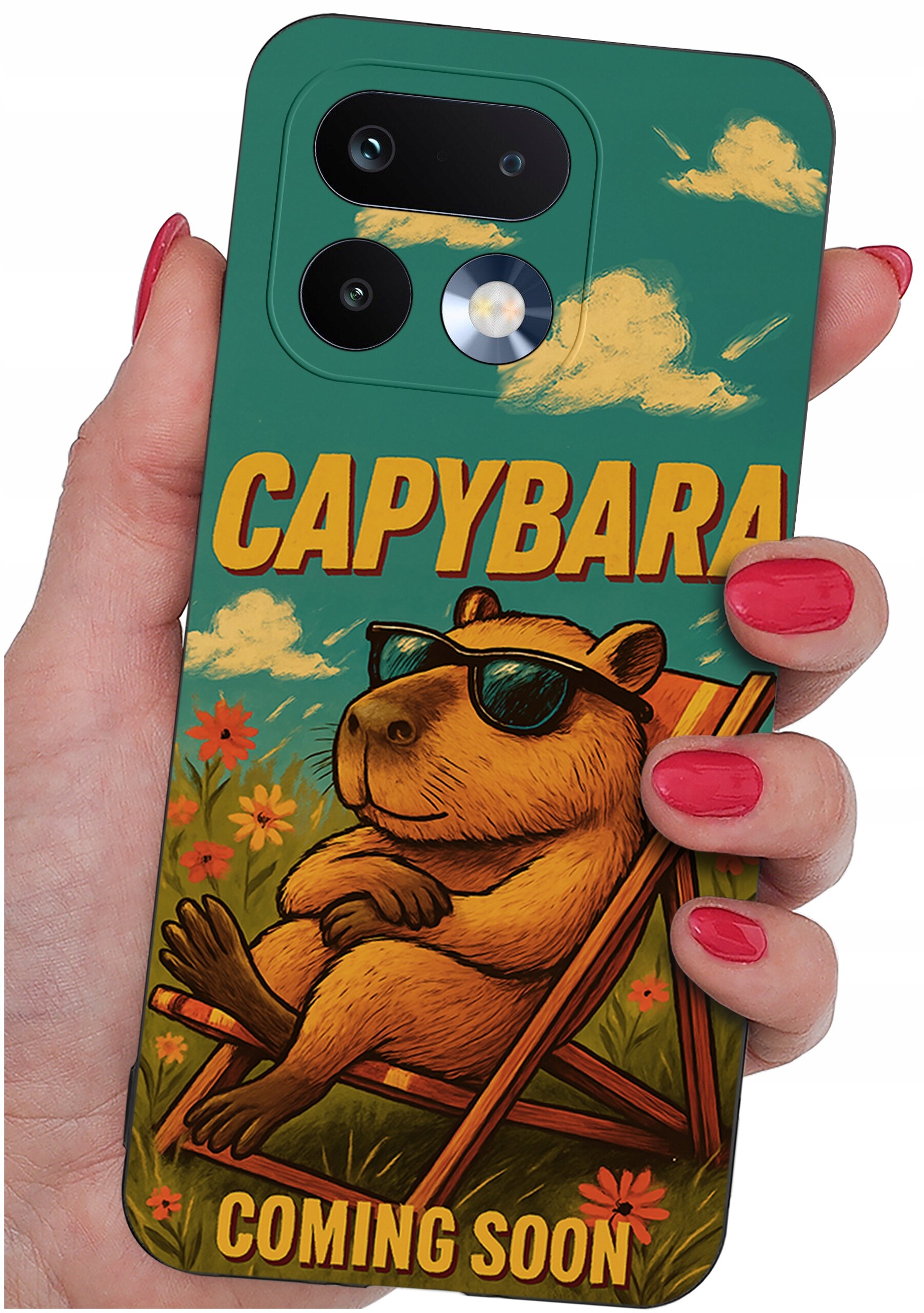 Etui na telefon z grafiką kapibary w okularach przeciwsłonecznych, siedzącej na leżaku, z napisem \'CAPYBARA COMING SOON\'.