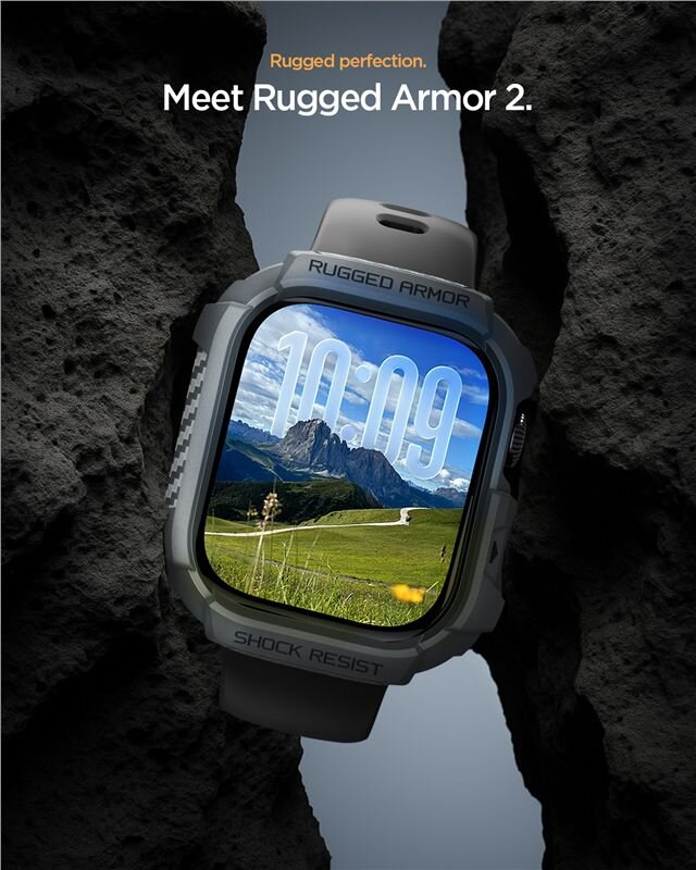Obraz przedstawia zegarek z wyświetlaczem pokazującym godzinę 10:09, otoczony szarą obudową z napisem \'RUGGED ARMOR\' i \'SHOCK RESIST\'. W tle widoczne są skały, a na ekranie zegarka krajobraz z górami i zielonym polem.