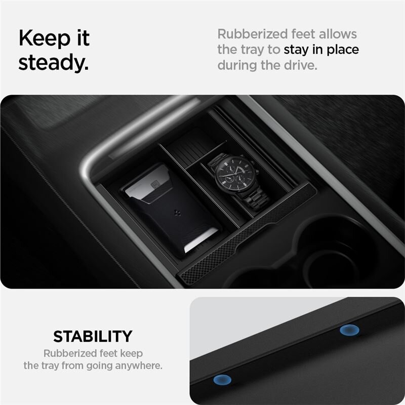 Na obrazie widoczny jest organizer konsoli środkowej z miejscem na zegarek i inne przedmioty. Tekst na obrazie: \'Keep it steady. Rubberized feet allows the tray to stay in place during the drive. STABILITY Rubberized feet keep the tray from going anywhere.\'