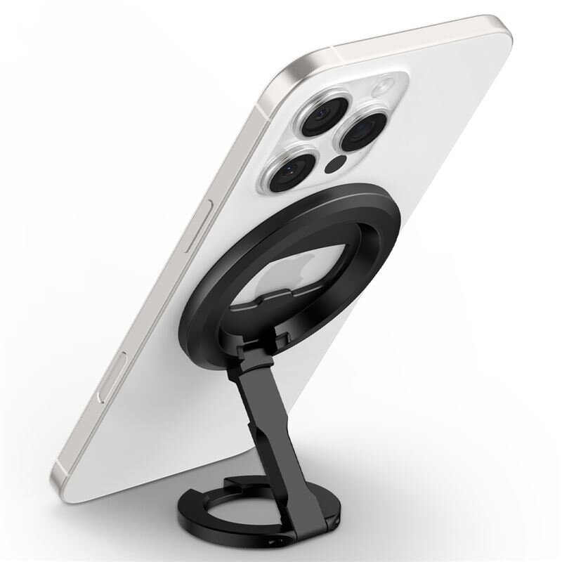 Na obrazie widoczny jest biały telefon z trzema obiektywami aparatu, zamocowany na czarnym, regulowanym uchwycie magnetycznym. Uchwyt ma okrągłą podstawę i jest ustawiony pod kątem, podtrzymując telefon w pozycji pionowej.