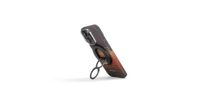 Etui na telefon z uchwytem w kolorze gradientowym, przechodzącym od ciemnego do jasnego odcienia. Widoczny jest pierścień do trzymania oraz tekst \'Pitaka\' na dole.
