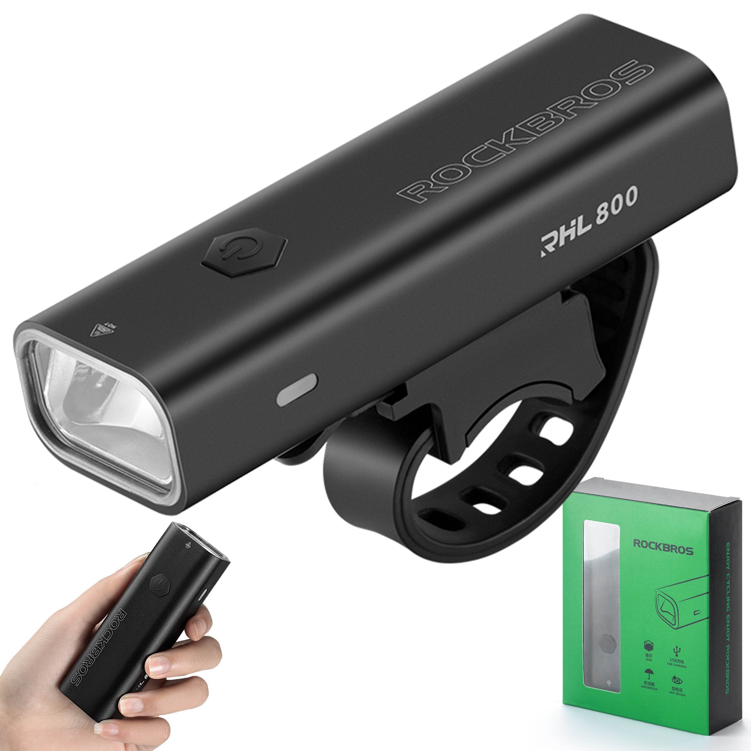 Czarna lampka rowerowa z napisem \'ROCKBROS RHL 800\' i przyciskiem na obudowie, zamontowana na uchwycie. Obok znajduje się zielone pudełko z okienkiem i napisem \'ROCKBROS\'.