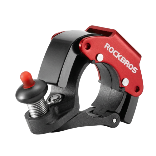 Mechaniczny dzwonek rowerowy w kolorze czarnym i czerwonym z widocznym logo \'ROCKBROS\'.
