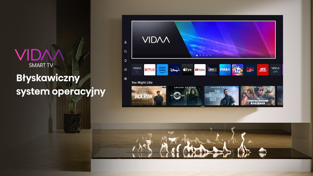 Na ścianie wisi telewizor z interfejsem VIDAA, wyświetlający aplikacje takie jak Netflix, Prime Video i YouTube. Obok widoczny jest napis \'VIDAA SMART TV Błyskawiczny system operacyjny\'.
