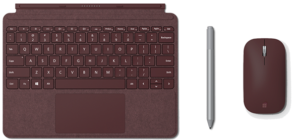 Na obrazie widoczny jest laptop z klawiaturą w kolorze bordowym, obok znajduje się myszka w tym samym kolorze oraz srebrny rysik. Klawiatura posiada standardowy układ klawiszy QWERTY.