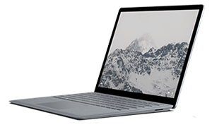 Laptop z otwartym ekranem, na którym wyświetlany jest obraz gór w odcieniach szarości. Obudowa jest w kolorze srebrnym.