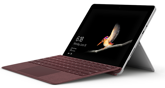 Laptop z odłączaną klawiaturą w kolorze bordowym, wyświetlający na ekranie obraz ptaka na gałęzi oraz godzinę 6:18 i datę Monday, June 18.
