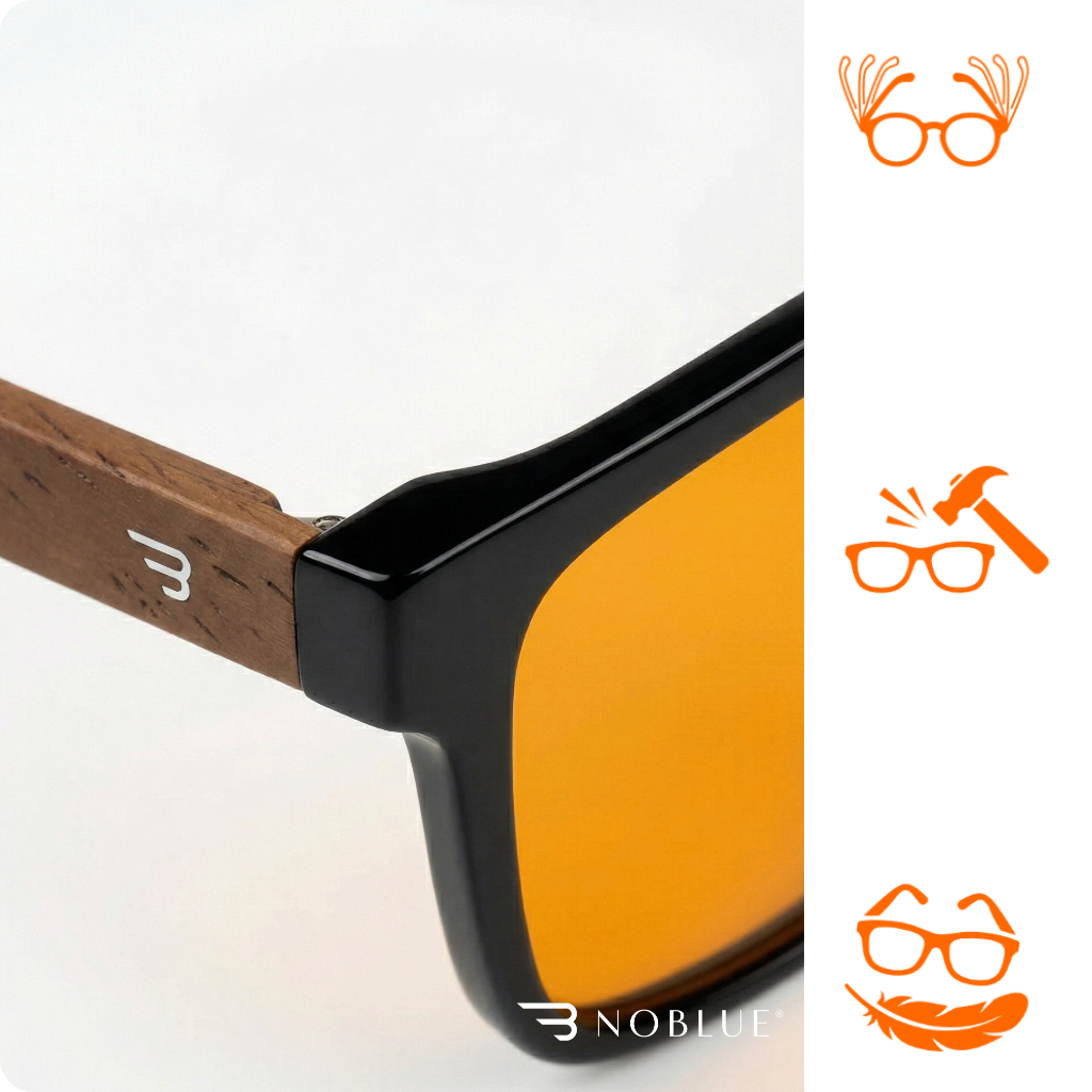 Okulary z pomarańczowymi soczewkami i drewnianymi zausznikami z logo \'B\'. Obok znajdują się trzy pomarańczowe ikony przedstawiające okulary z różnymi symbolami oraz napis \'NOBLUE\'.